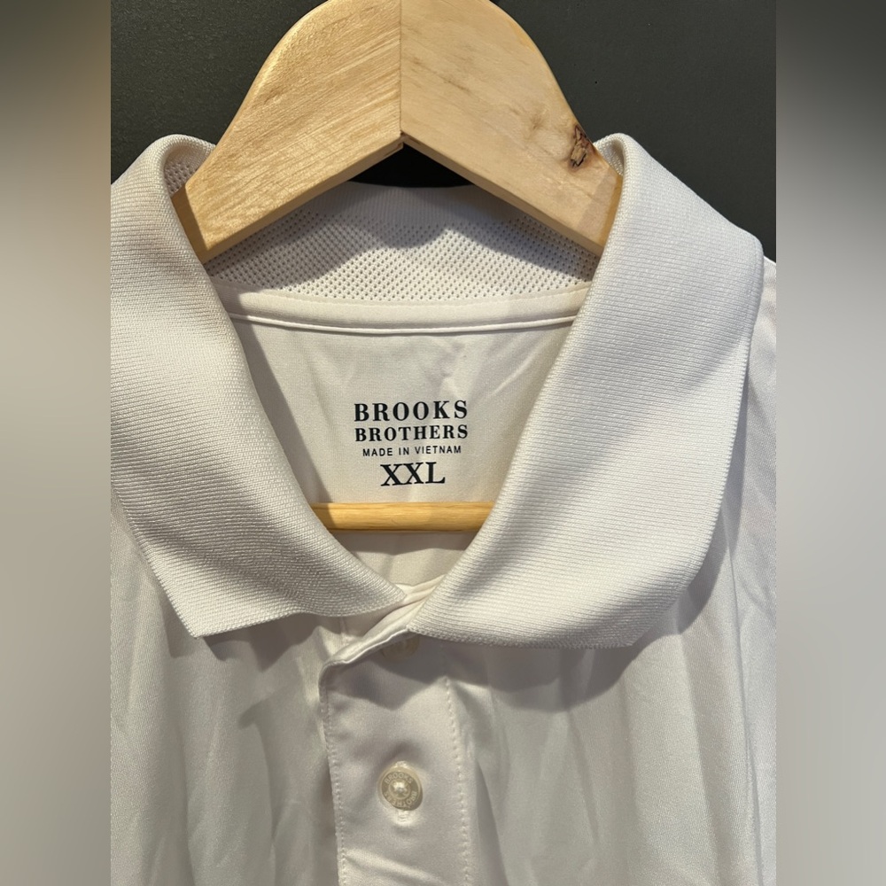 The Brooks Brothers Performance Series XXL white with logo on the right sleeve.